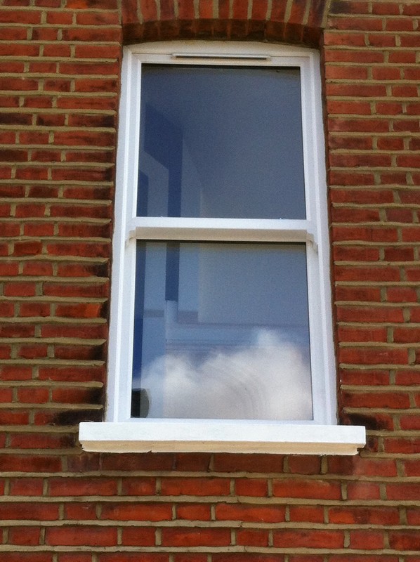 uPVC sash window on Victorian red brick house in Alexandra Palace